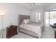 Spacious bedroom with a large bed and access to the pool at 23635 Oakside Blvd, Lutz, FL 33559