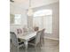 Formal dining room with a large table and hardwood floors at 23635 Oakside Blvd, Lutz, FL 33559