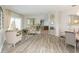 Open living and dining area with hardwood floors and lots of natural light at 23635 Oakside Blvd, Lutz, FL 33559