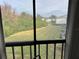 View of grassy backyard from condo balcony at 11201 122Nd Ave # 204, Largo, FL 33778