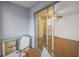 Small balcony with glass table and chairs, view into bedroom at 11201 122Nd Ave # 204, Largo, FL 33778