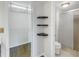Bathroom with shower, toilet, and closet with shelving at 11201 122Nd Ave # 204, Largo, FL 33778