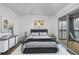 Main bedroom with dark gray bed frame and access to balcony at 11201 122Nd Ave # 204, Largo, FL 33778