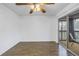 Bright bedroom with wood flooring, sliding door to balcony, ceiling fan at 11201 122Nd Ave # 204, Largo, FL 33778