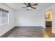Bright bedroom with laminate floors, ceiling fan and en-suite bathroom at 11201 122Nd Ave # 204, Largo, FL 33778