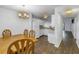 Dining area with wood table and chairs, adjacent to kitchen at 11201 122Nd Ave # 204, Largo, FL 33778