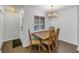 Dining area with wood table and chairs near entryway at 11201 122Nd Ave # 204, Largo, FL 33778