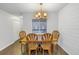 Charming dining room with wood table and chairs, and wood-paneled wall at 11201 122Nd Ave # 204, Largo, FL 33778