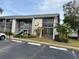 Exterior of condo building with parking and landscaping at 11201 122Nd Ave # 204, Largo, FL 33778