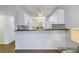 Kitchen with dark countertop and white cabinets at 11201 122Nd Ave # 204, Largo, FL 33778