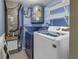 Laundry room with washer, dryer, and shelving at 11201 122Nd Ave # 204, Largo, FL 33778