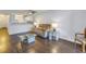 Living room with a sofa, coffee table and balcony access at 11201 122Nd Ave # 204, Largo, FL 33778