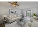 Spacious living room with a comfy sofa and access to a balcony at 11201 122Nd Ave # 204, Largo, FL 33778