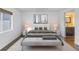 Main bedroom with a queen-size bed, en-suite bathroom, and a window at 11201 122Nd Ave # 204, Largo, FL 33778