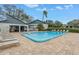 Community pool with lounge chairs and covered area at 11201 122Nd Ave # 204, Largo, FL 33778