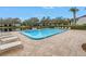 Inviting community pool with ample lounge chairs at 11201 122Nd Ave # 204, Largo, FL 33778