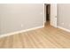 Spacious bedroom with light grey walls and wood-look flooring at 14538 Pimberton Dr, Hudson, FL 34667