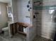 Bathroom with shower, toilet and partially installed vanity at 16108 5Th E St, Redington Beach, FL 33708