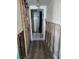 Bathroom with updated shower and gray tile flooring at 16108 5Th E St, Redington Beach, FL 33708