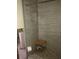 Renovated bathroom with shower and pebble floor at 16108 5Th E St, Redington Beach, FL 33708