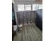 Unfinished interior room with exposed brick and new flooring at 16108 5Th E St, Redington Beach, FL 33708