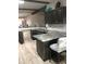 Spacious kitchen with island, granite countertops and dark gray cabinets at 16108 5Th E St, Redington Beach, FL 33708