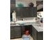 Modern kitchen with granite countertops and gray cabinets at 16108 5Th E St, Redington Beach, FL 33708
