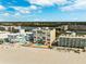 Aerial view of beachfront property with pool and surrounding buildings at 19450 Gulf Blvd # 401, Indian Shores, FL 33785