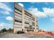 Beachfront building exterior, showcasing its architecture and ocean views at 19450 Gulf Blvd # 401, Indian Shores, FL 33785