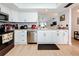 Renovated kitchen with white cabinets, stainless steel appliances, and granite counters at 2058 Sheffield Ct, Oldsmar, FL 34677