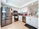 Modern kitchen with stainless steel appliances and white shaker cabinets at 2058 Sheffield Ct, Oldsmar, FL 34677