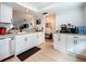 Updated kitchen with white cabinets, granite counters and breakfast bar at 2058 Sheffield Ct, Oldsmar, FL 34677