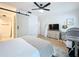 Main bedroom with king-size bed, dresser, and a crib at 2058 Sheffield Ct, Oldsmar, FL 34677