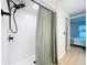 Modern shower with updated fixtures and a curtain at 2058 Sheffield Ct, Oldsmar, FL 34677