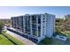 Exterior view of condo building with parking at 220 Belleview Blvd # 609, Belleair, FL 33756