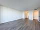 Large bedroom with hardwood floors and access to bathroom at 220 Belleview Blvd # 609, Belleair, FL 33756