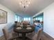 Elegant dining room with hardwood floors and a chandelier at 220 Belleview Blvd # 609, Belleair, FL 33756
