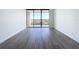 Bright living room with hardwood floors and sliding glass doors at 220 Belleview Blvd # 609, Belleair, FL 33756