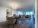 Open concept living and dining area with hardwood floors and city views at 220 Belleview Blvd # 609, Belleair, FL 33756