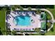 Aerial view of resort-style pool with surrounding deck and lounge chairs at 220 Belleview Blvd # 609, Belleair, FL 33756