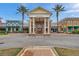 Community clubhouse with columns and brick facade at 22294 Storybook Cabin Way, Land O Lakes, FL 34637