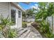 Landscaped backyard with brick pathway and pergola at 236 9Th Ne Ave, St Petersburg, FL 33701