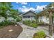 Landscaped backyard with brick pathway and pergola at 236 9Th Ne Ave, St Petersburg, FL 33701