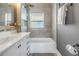 Updated bathroom with a tub and shower at 236 9Th Ne Ave, St Petersburg, FL 33701