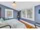 Bedroom with hardwood floors and two windows at 236 9Th Ne Ave, St Petersburg, FL 33701