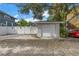 Detached garage with white door and brick facade at 236 9Th Ne Ave, St Petersburg, FL 33701