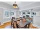 Bright dining room with hardwood floors and a wood table, seating six at 236 9Th Ne Ave, St Petersburg, FL 33701