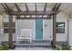 Inviting front porch with a rocking chair and pergola at 236 9Th Ne Ave, St Petersburg, FL 33701