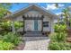 Charming bungalow with a landscaped front yard, walkway, and pergola at 236 9Th Ne Ave, St Petersburg, FL 33701