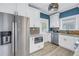Stainless steel appliances and white shaker cabinets highlight this kitchen at 236 9Th Ne Ave, St Petersburg, FL 33701